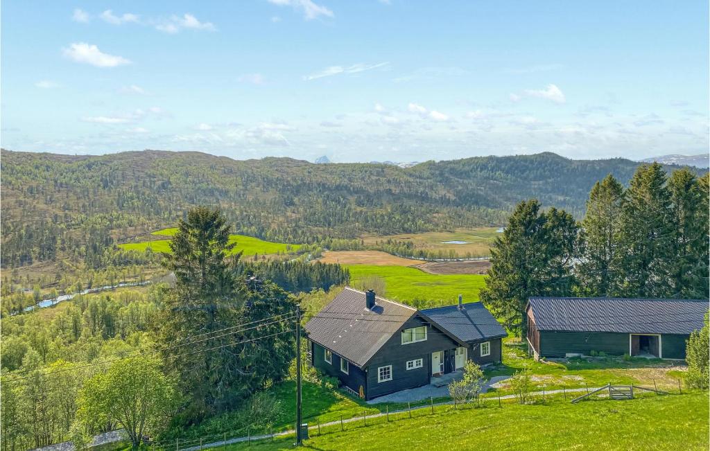 an aerial view of a house on a hill at Beautiful Home In Frde With House A Panoramic View in Førde