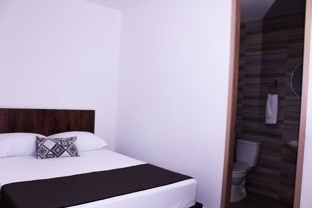 Postel nebo postele na pokoji v ubytování Ayenda Hotel MM