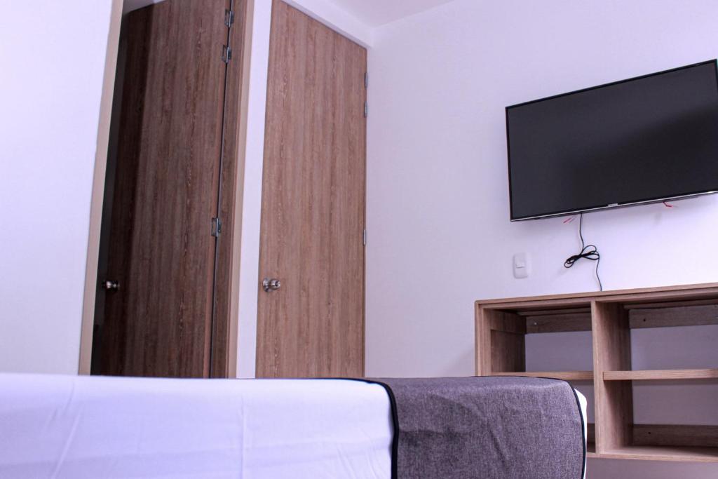 TV a/nebo společenská místnost v ubytování Ayenda Hotel MM