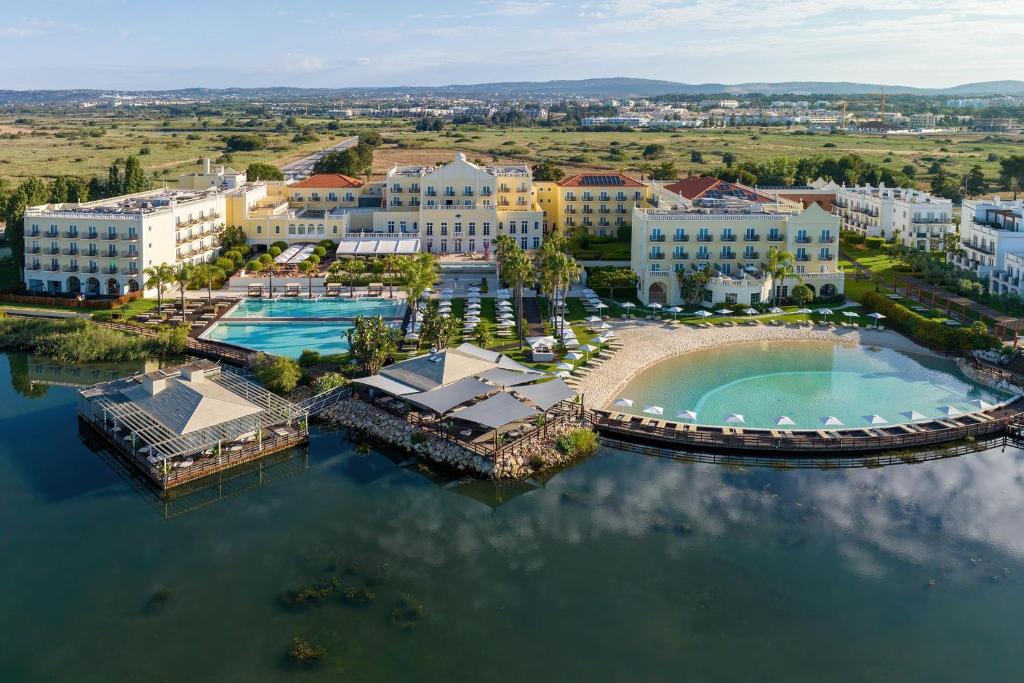 an aerial view of a resort on the water at Domes Lake Algarve, Autograph Collection in Vilamoura