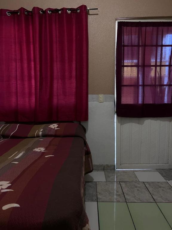 Postel nebo postele na pokoji v ubytování Hotel Antonio