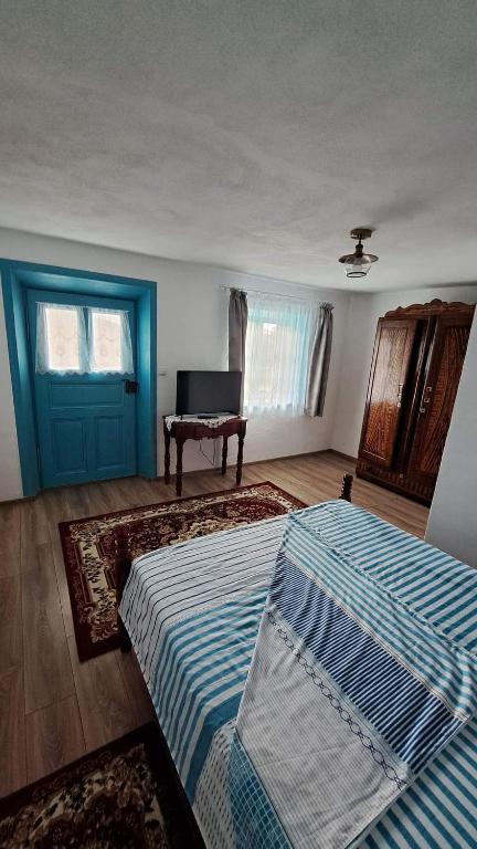 Postel nebo postele na pokoji v ubytování Pensiunea Casa Golovita