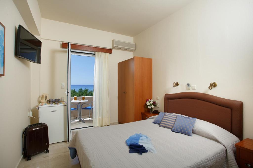 Posteľ alebo postele v izbe v ubytovaní Morpheas Apartments