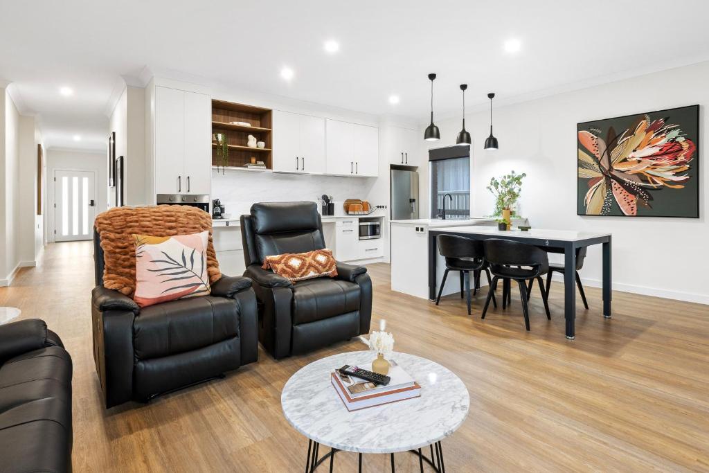 a living room with a couch and a table at City Edge Apartment 1 (Wheelchair Accessible) in Mount Gambier