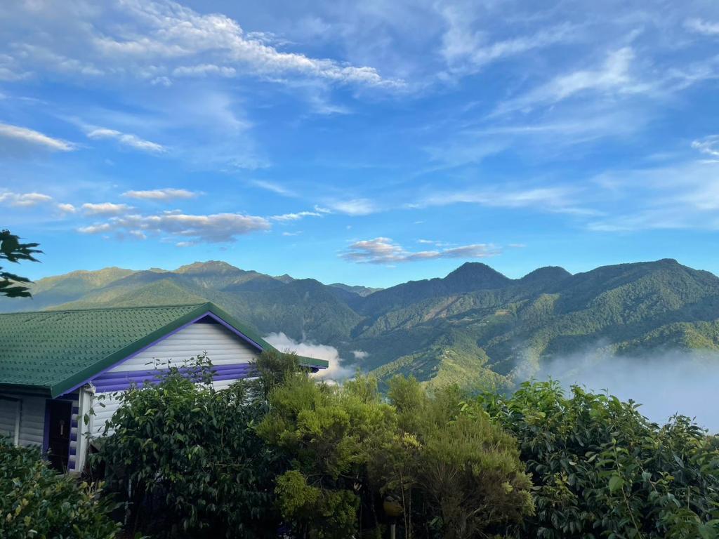 a house with a view of the mountains at Julie&#39;s Garden, Cingjing - Fon Chin Homestay in Ren&#39;ai