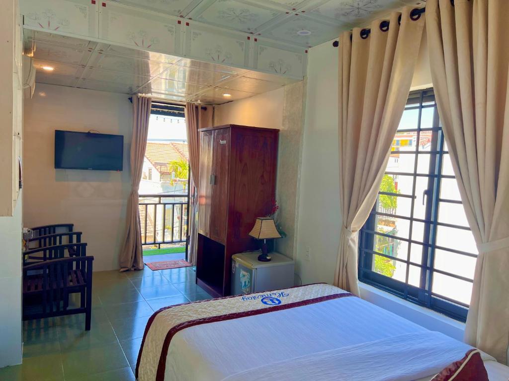 Postel nebo postele na pokoji v ubytování Hoi An Ngo Homestay