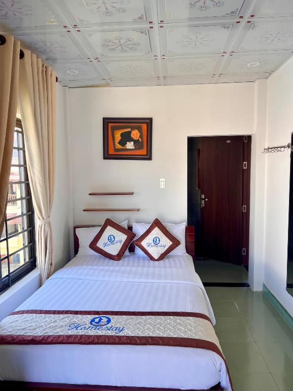 Postel nebo postele na pokoji v ubytování Hoi An Ngo Homestay