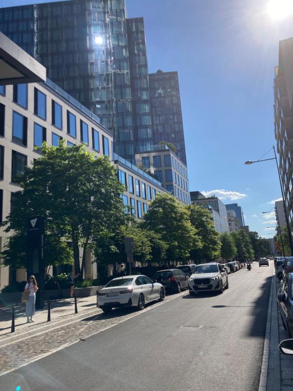 a city street with cars parked on the side of the road at Cozy Apartment in Centrum Downtown Śródmieście Żelazna Zelazna Jerozolimskie Palace of Culture and Science! Wifi, Netflix, HBO, SmartTV 55cal in Warsaw