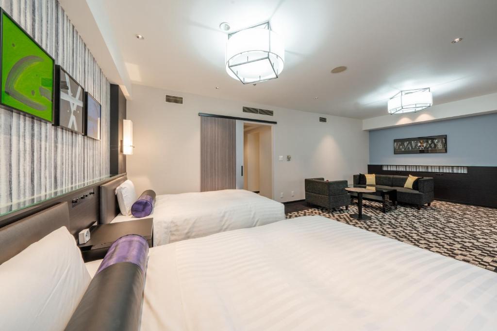 Tempat tidur dalam kamar di New Otani Inn Sapporo