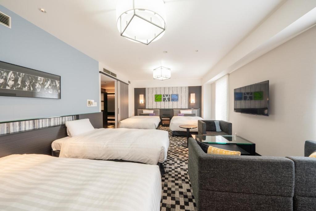 Tempat tidur dalam kamar di New Otani Inn Sapporo