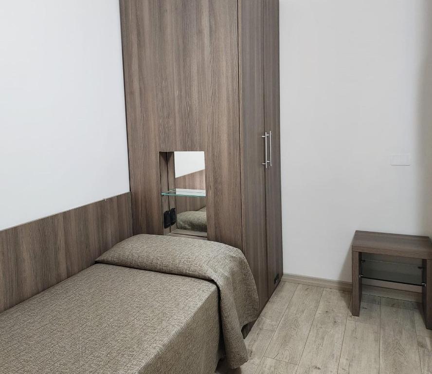 Postel nebo postele na pokoji v ubytování Hotel Miramare Dipendenza