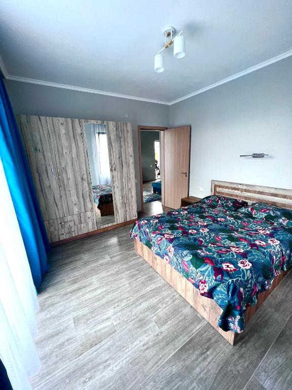 Postel nebo postele na pokoji v ubytování Apollo Plus Cottages