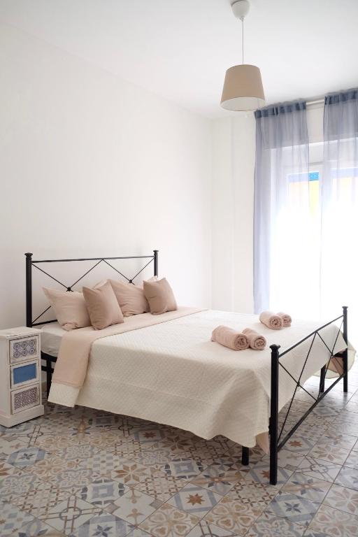 Postel nebo postele na pokoji v ubytování NERI Rooms