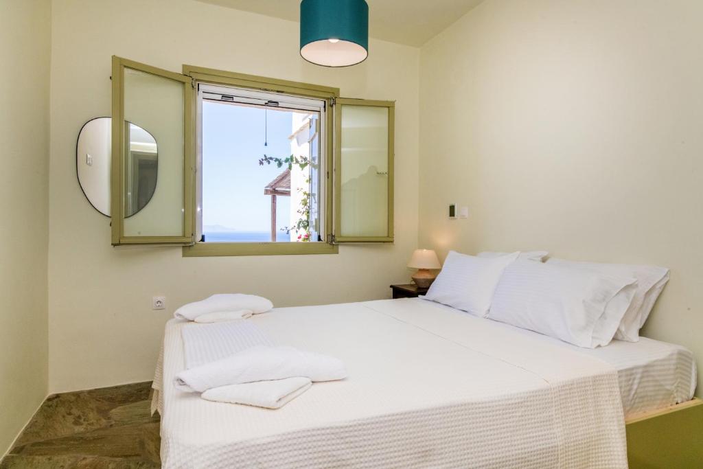 Postel nebo postele na pokoji v ubytování ReGenesis Villas