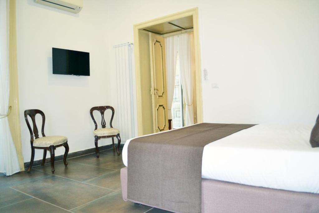 A bed or beds in a room at questo rinascimento CASA NEWMAN