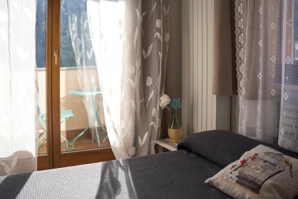 Łóżko lub łóżka w pokoju w obiekcie Casa Furia