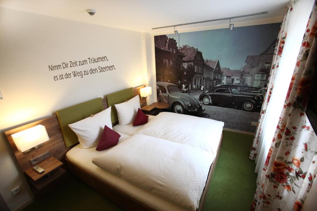 Postel nebo postele na pokoji v ubytování Hotel Schmidt am Markt
