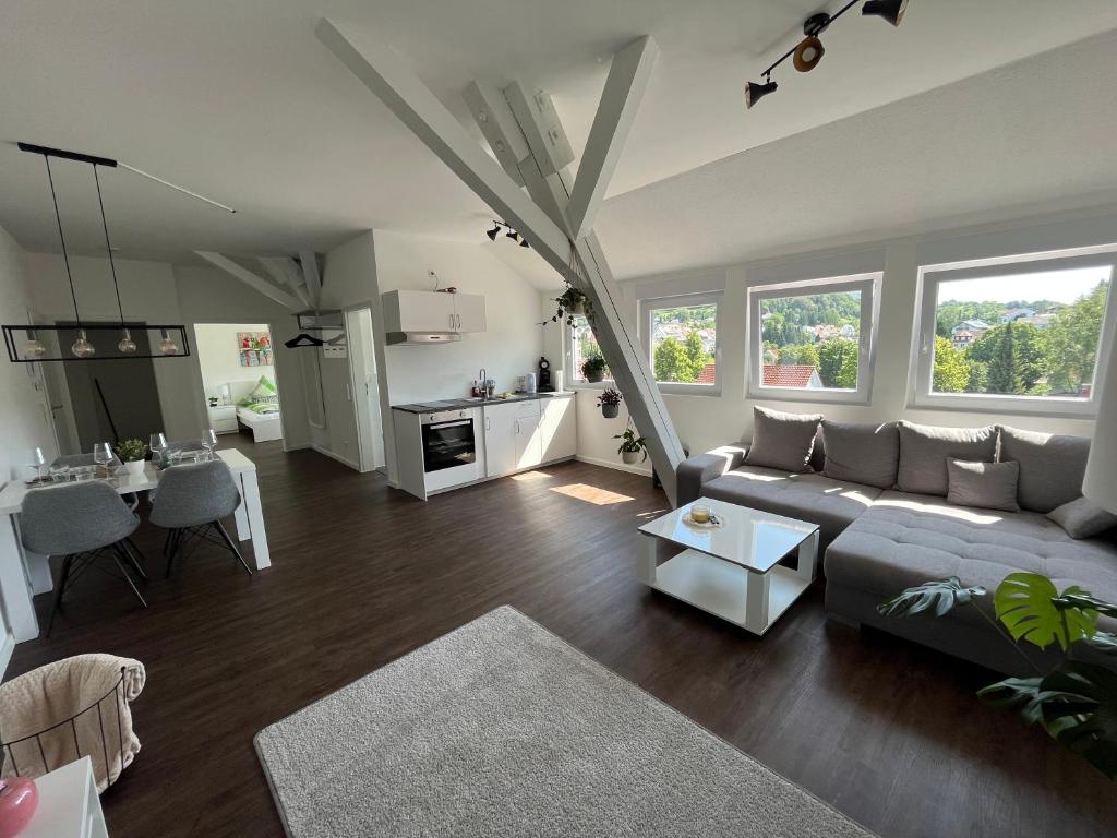 a living room with a couch and a table at Stauffenberg Apartments in Albstadt