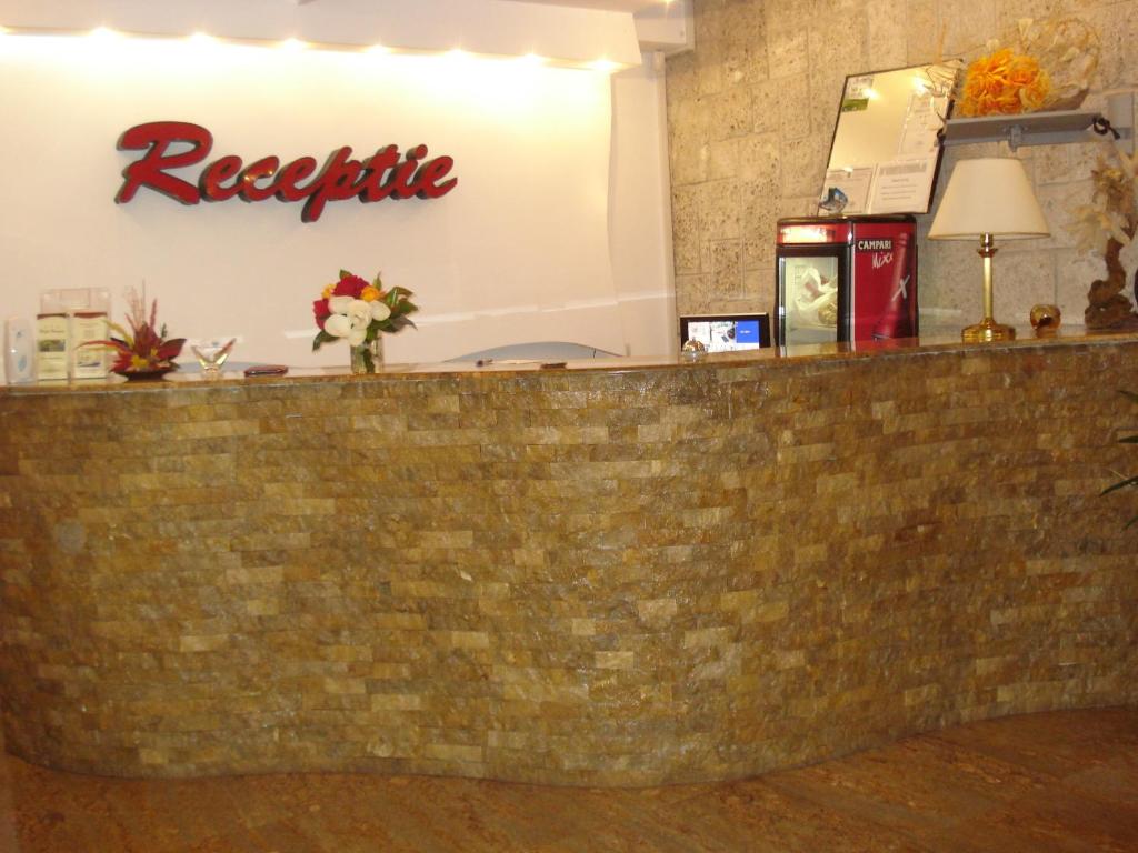 a bar at the reception desk of a restaurant at Hotel Hermes in Eforie Nord