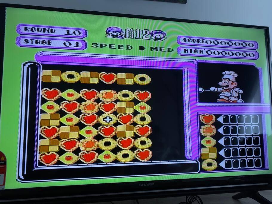 a television screen with a video game on it at Simfoni Tower 3R2B 8pax @C180@Chr Trader Square in Seri Kembangan