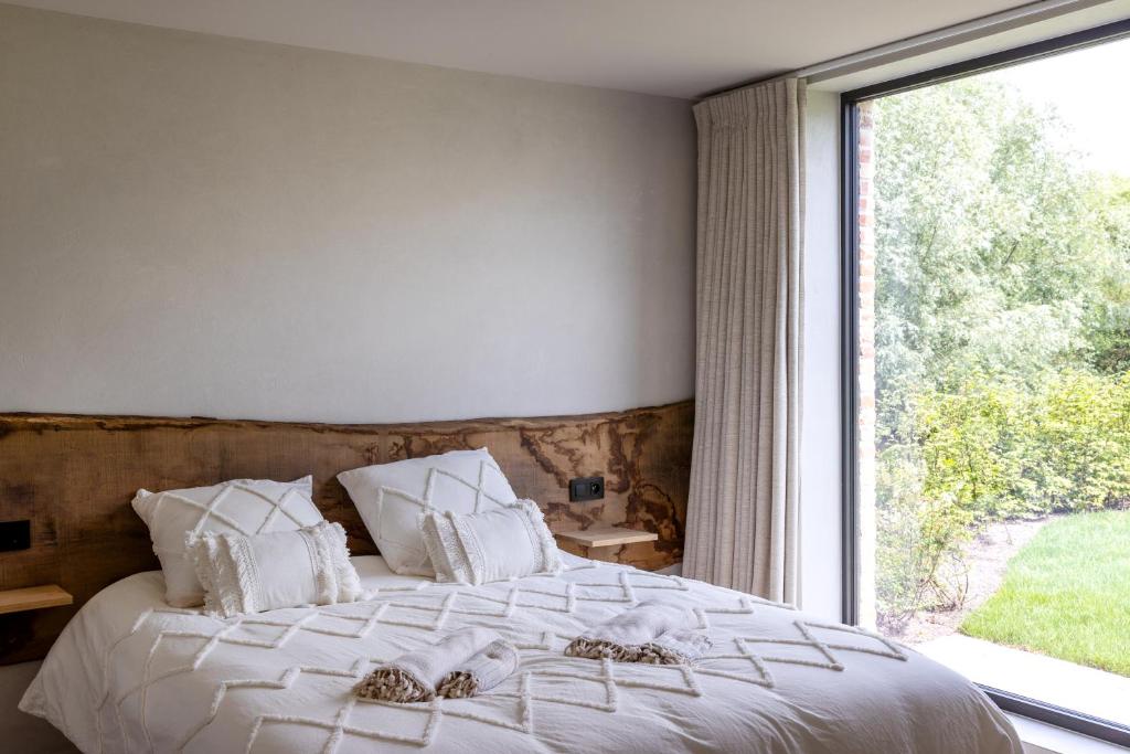 Postel nebo postele na pokoji v ubytování 't Hooiland