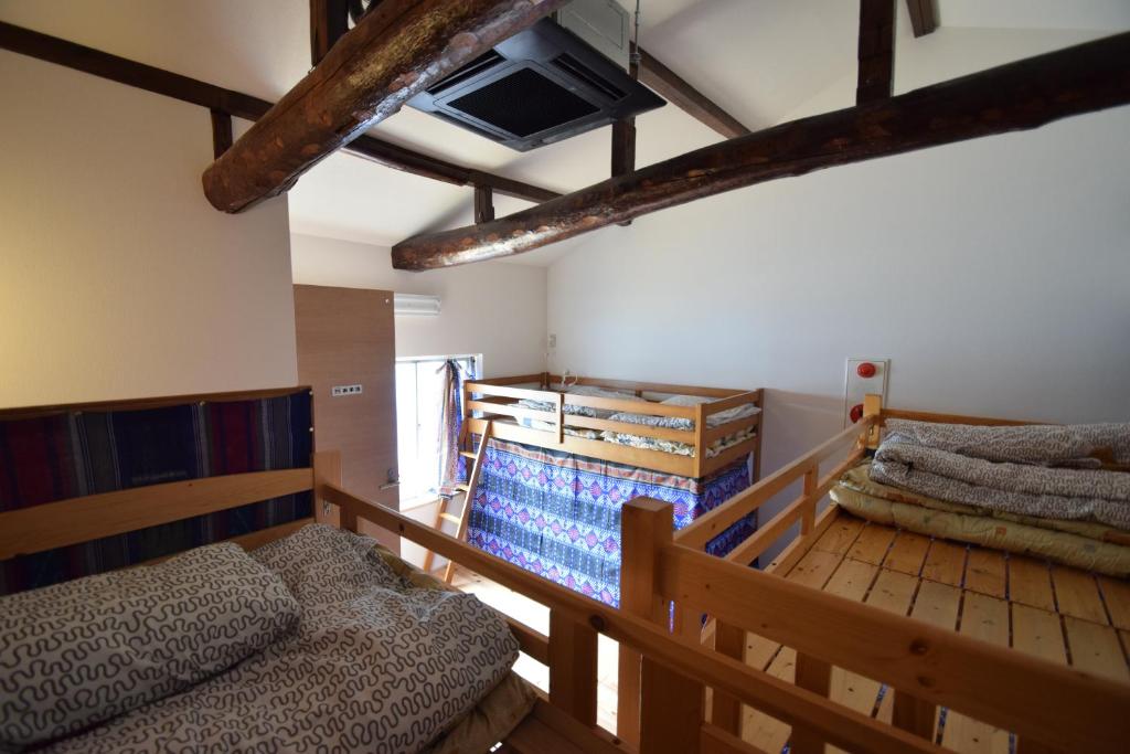 Postel nebo postele na pokoji v ubytování Santana Guest House Kyoto