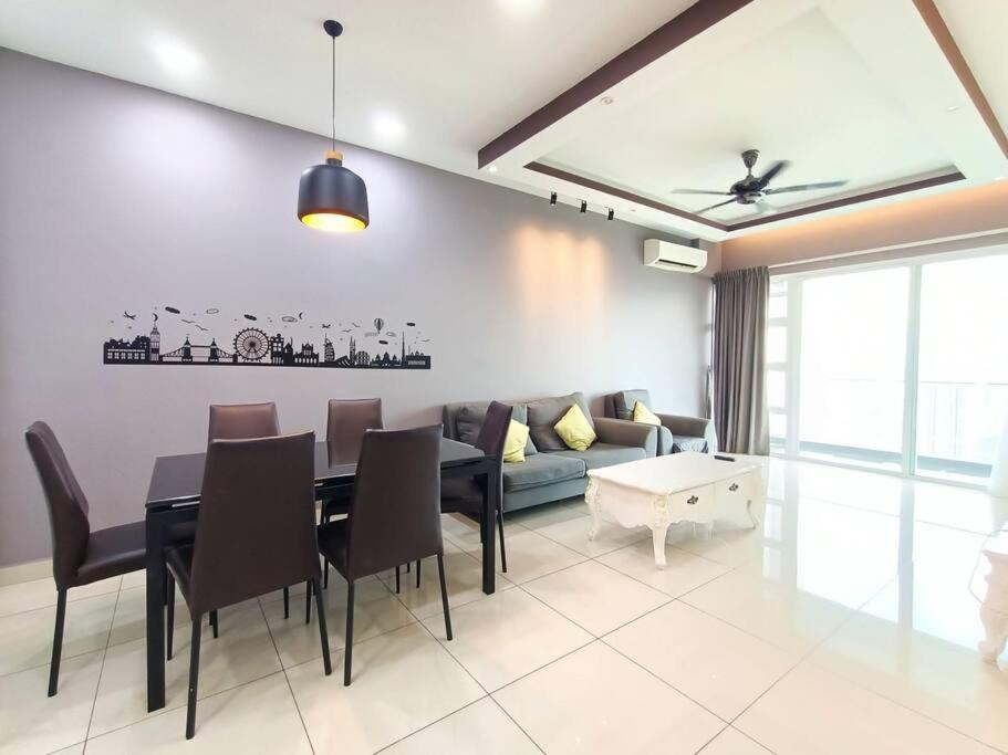 a living room with a table and a couch at Johor Bahru Luxury Pinnacle Tower 3 Bed 2 Bath in Johor Bahru