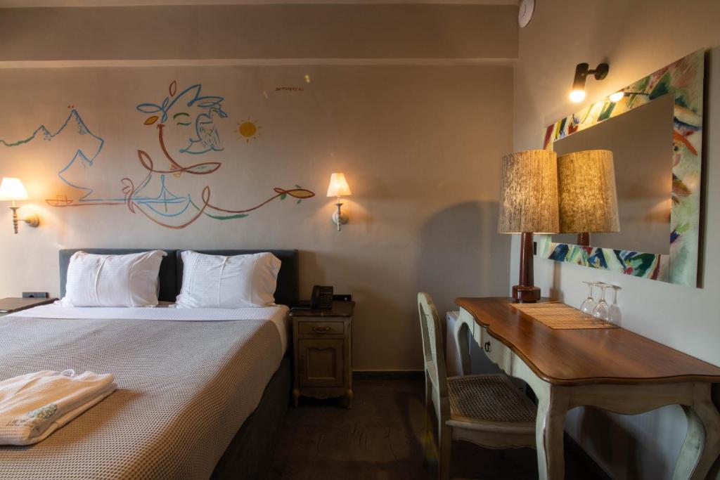 Postel nebo postele na pokoji v ubytování Petra & Fos Boutique Hotel & Spa