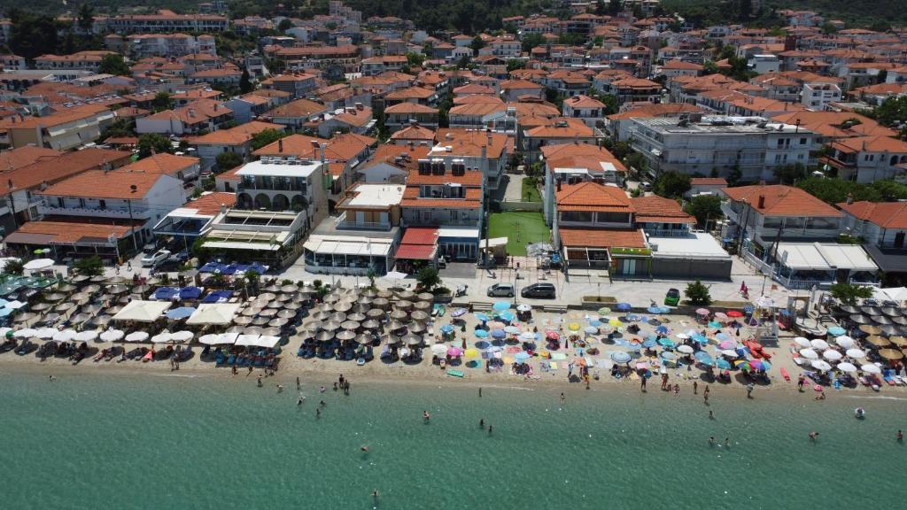 an aerial view of a beach with umbrellas at Del Soll in Polychrono