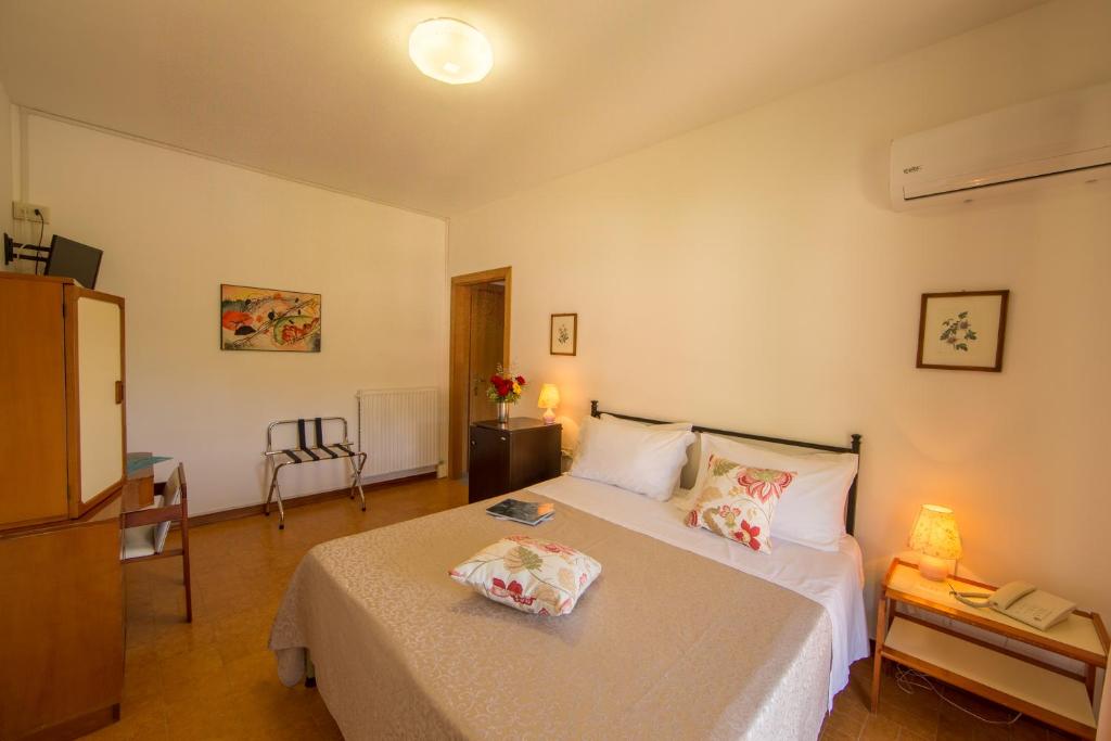 Postel nebo postele na pokoji v ubytování Hotel La Feluca