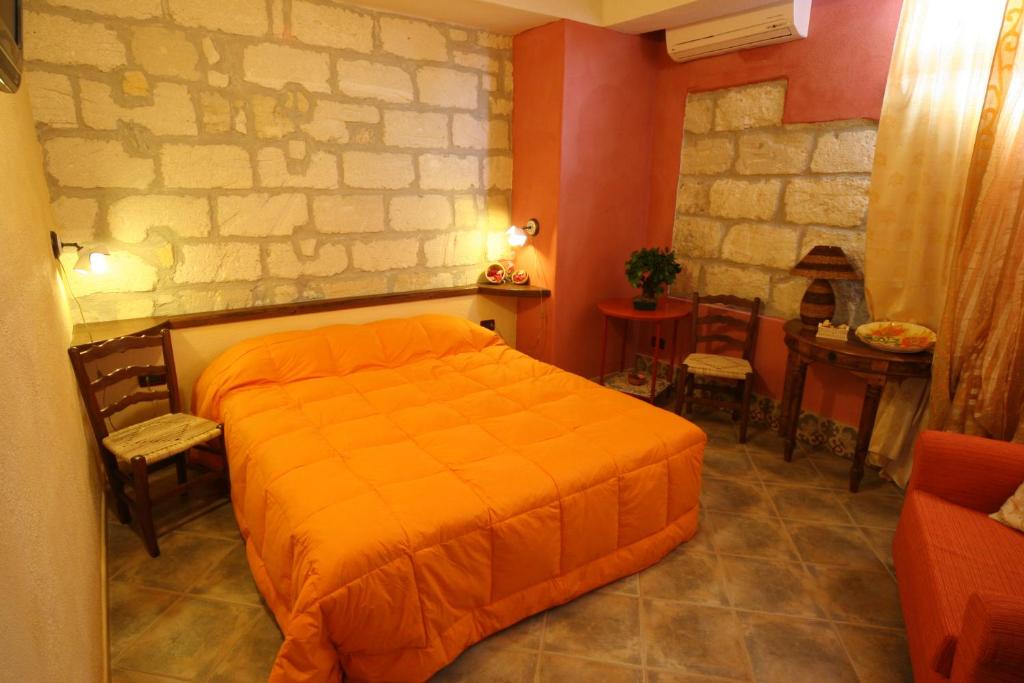 Postel nebo postele na pokoji v ubytování B&B Alfrantoio Valderice