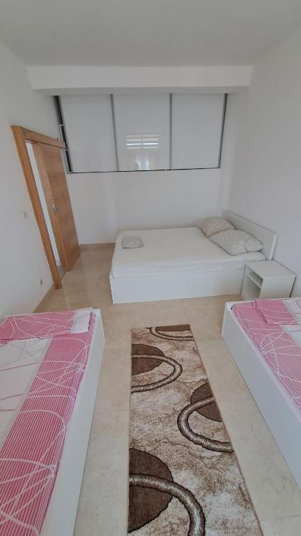 Postel nebo postele na pokoji v ubytování Apartmani Dodig