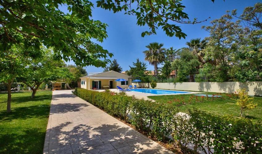 a house with a swimming pool in a yard at Villa Esperanza by Imagine Lefkada in Lefkada Town
