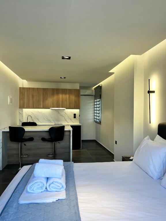 Postel nebo postele na pokoji v ubytování InLofts