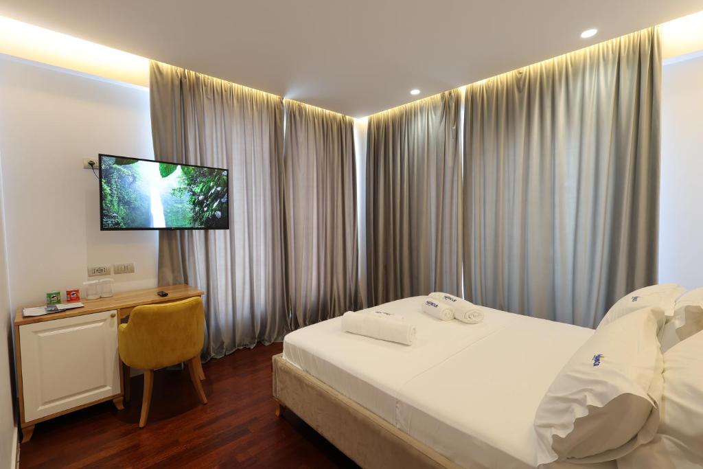 Postel nebo postele na pokoji v ubytování Harbour Hotel