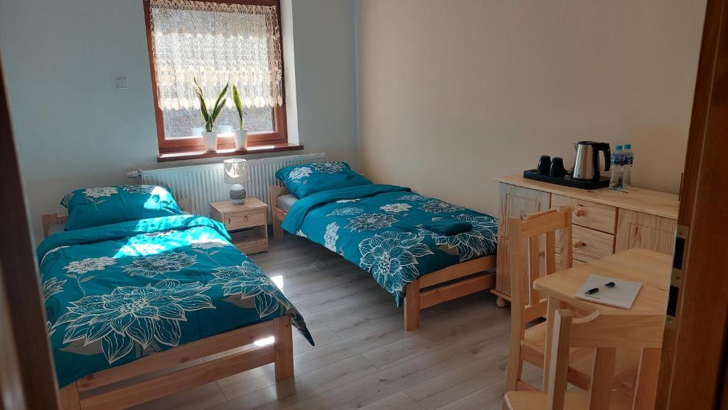 Кровать или кровати в номере Agroturystyka Zielona Dolina