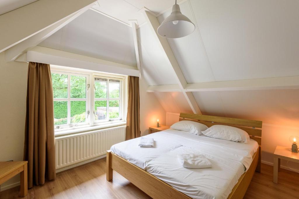 Postel nebo postele na pokoji v ubytování LUXE vakantiehuis voor 6P voorzien van alle gemakken @Veluwe