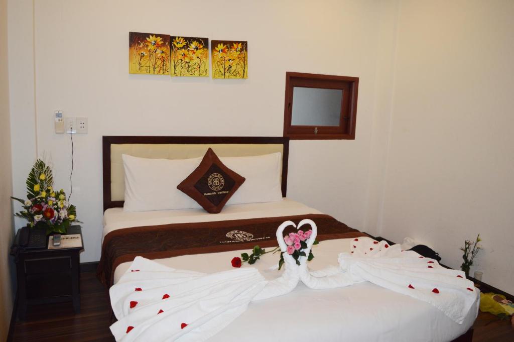 Postel nebo postele na pokoji v ubytování Brown Bean 2 Hotel
