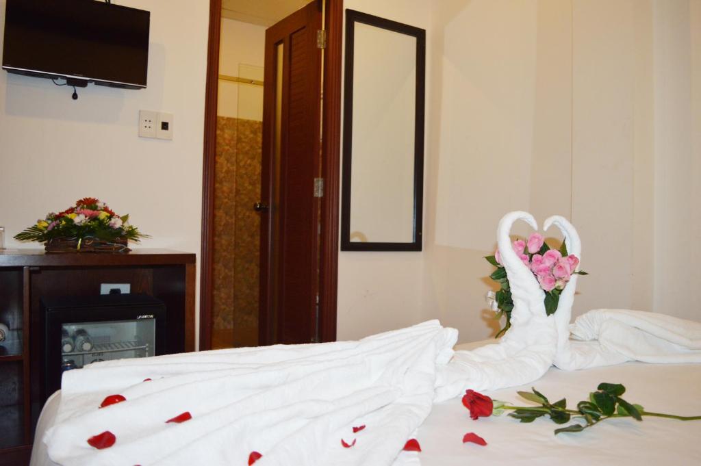Postel nebo postele na pokoji v ubytování Brown Bean 2 Hotel