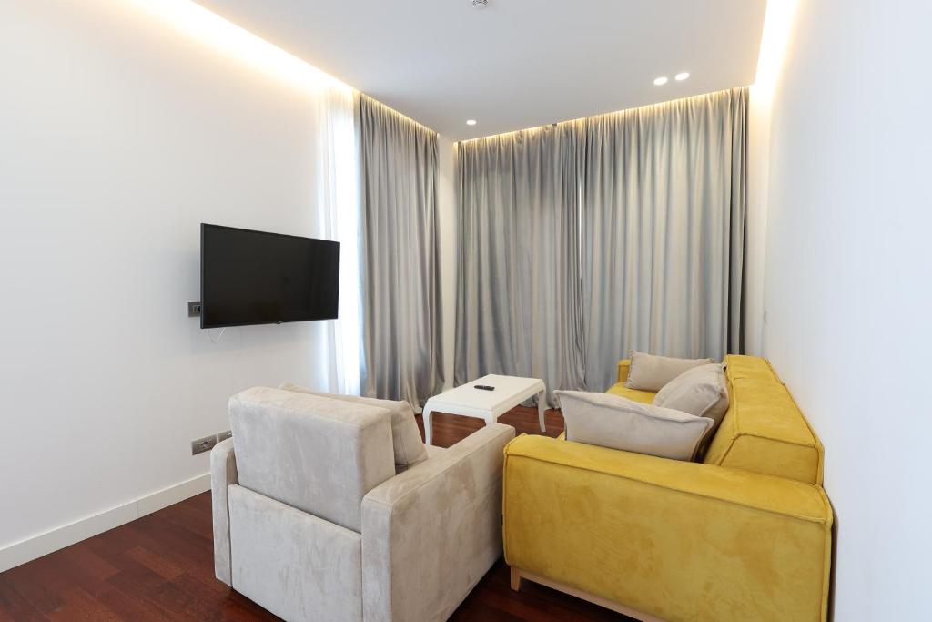 TV a/nebo společenská místnost v ubytování Harbour Hotel