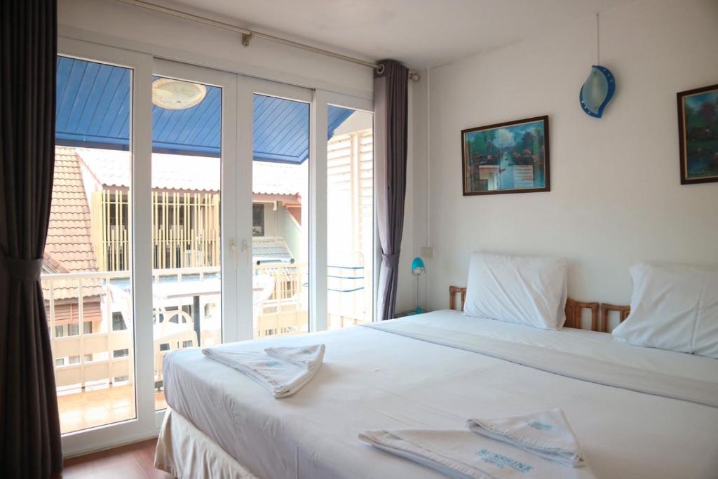 Postel nebo postele na pokoji v ubytování Sunshine Guest House