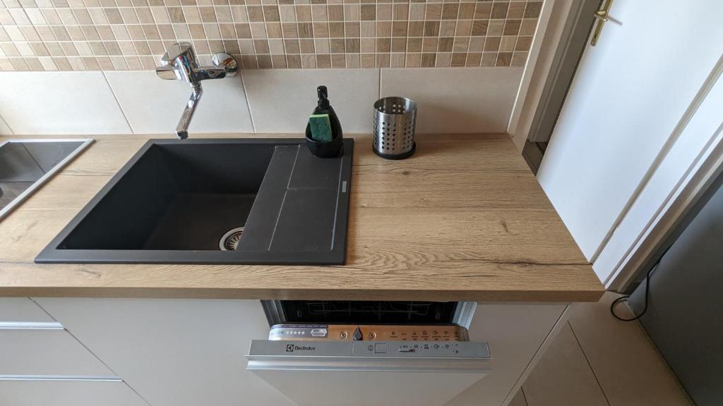 Kuchyňa alebo kuchynka v ubytovaní Virágos Apartman Balatonszemes