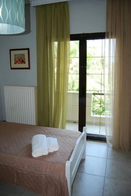 Postel nebo postele na pokoji v ubytování Luna Apartment, Rafina