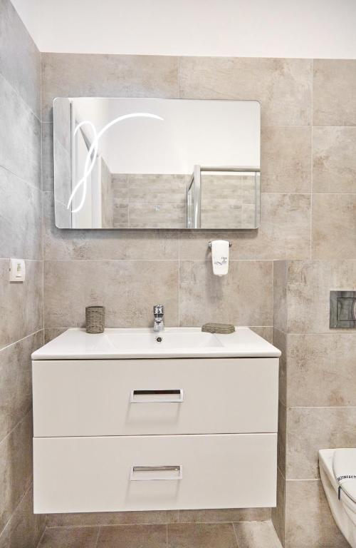 Ванная комната в Excelsior Apartaments Mamaia Nord