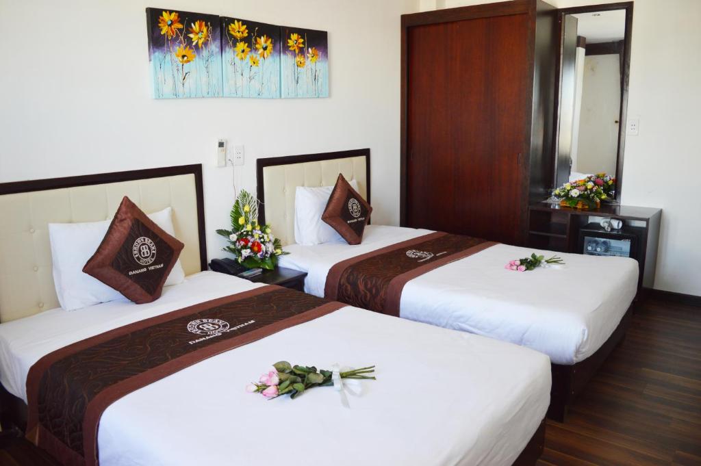 Postel nebo postele na pokoji v ubytování Brown Bean 2 Hotel