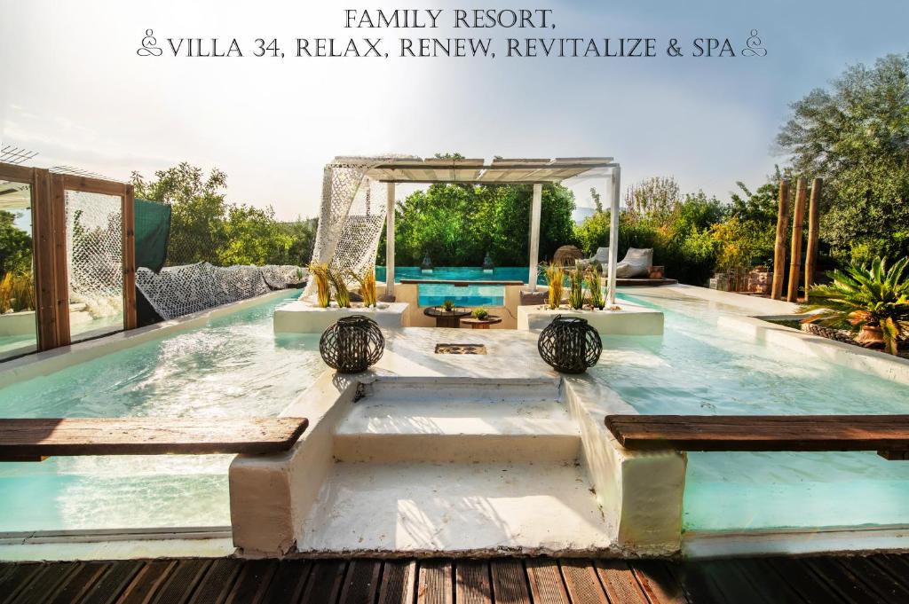 a pool at a luxury resort with a spa at Villa34 Family resort Renew, Relax, Revitalise & Spa Suite in Aghia Marina