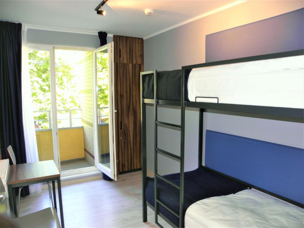 Postel nebo postele na pokoji v ubytování Hostel Annamarie