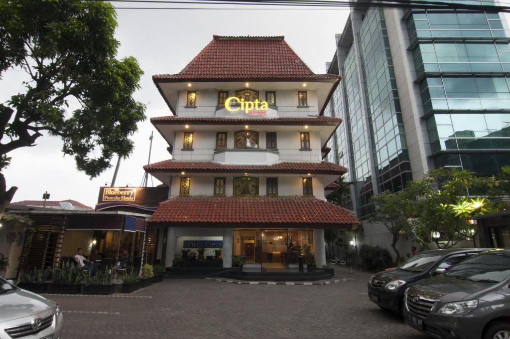 a building with a sign on top of it at Cipta Hotel Wahid Hasyim in Jakarta