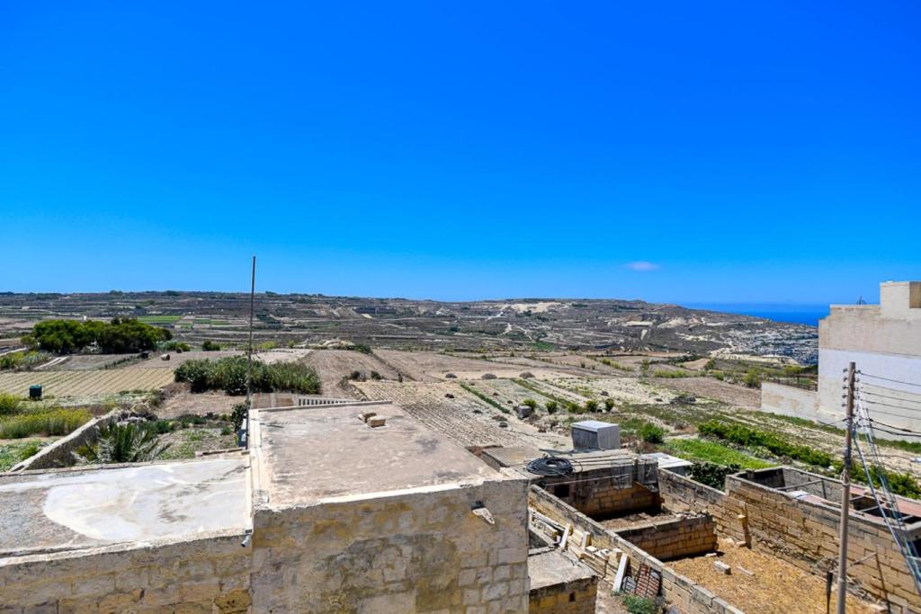 a view of the city from the roof of a building at Azure W B&B in San Lawrenz