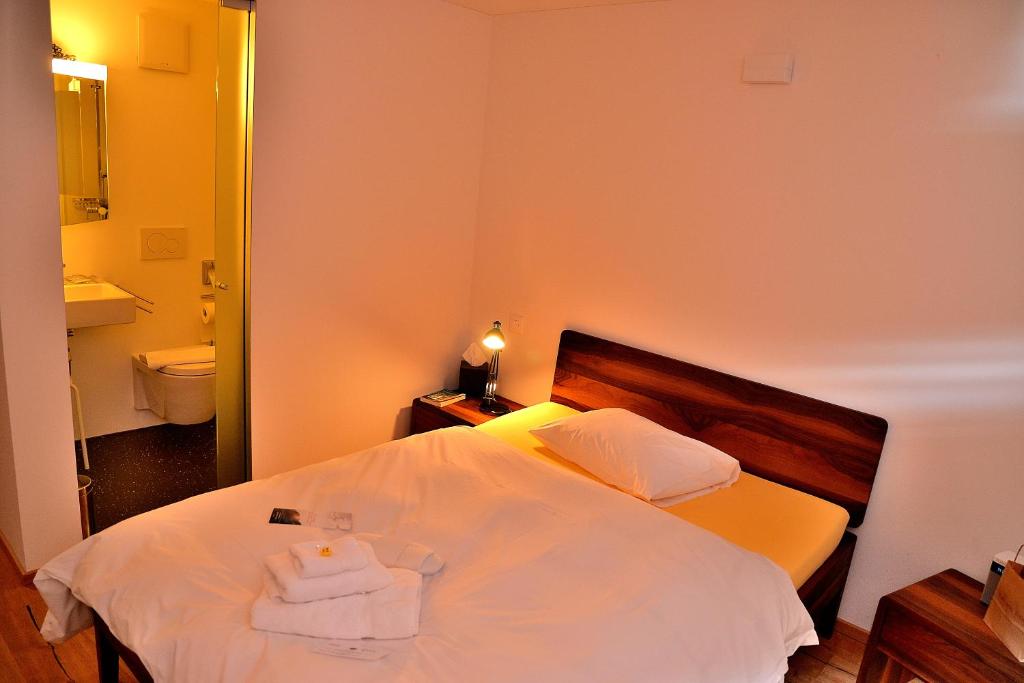 Postel nebo postele na pokoji v ubytování Unique Hotel Fusio